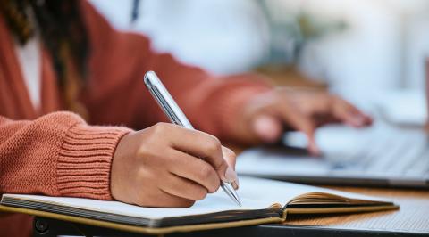 young woman writing